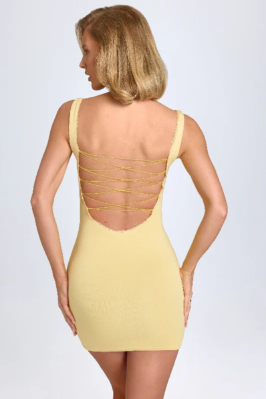 ladies-bodycon-dress-sporty-skip-Modal Lace-Trim Bodycon Mini Dress in Pastel Yellow